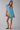 Female wearing a Ferozi Blue Solid Color A-Line Scoop Neckline Dress