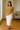 Female wearing a Beige Solid Color Western V-Neck Neckline Top