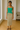 Female wearing a Green Solid Color Western Square Neckline Top