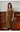 Female wearing a Mustard Solid Color Kurta V-Neckline Neckline Shawl Collar Shirt