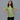 Female wearing a Green  Color Yellow Chameli Print Print Fusion Style Round Neckline Cotton Cambric Tunic
