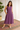 Female wearing a Purple Solid Color Flared Slashed Neckline No Collar Dress
