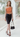 Female wearing a Orange Solid Color Western Asymmetric Neckline Top