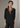 Female wearing a Black Solid Color Fusion V-Neck Neckline Notched Collar Top