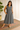 Female wearing a Grey Solid Color Flared Slashed Neckline No Collar  Dress