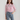 Female wearing a Pink Solid Color Fusion V-Neck Neckline Mandarin Collar Top