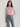 Female wearing a Pink Solid Color Fusion V-Neck Neckline Mandarin Collar Top
