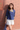 Female wearing a Blue Solid Color Fusion Round Neckline No Collar Top