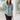 Female wearing a Greyish Blue Solid Color Ethnic No Neckline Regular Collar Tunic