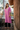 Female wearing a Rose Pink Solid Color Straight Trapeze Neckline Continuous Collar Kurta