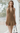Female wearing a Mustard Solid Color Babydoll V-Neck Neckline Dress