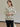 Female wearing a White  Color Black Stripes Pattern Print Work Style V-Neckline Neckline Cotton Cambric Shirt