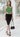 Female wearing a Greenish Rust Solid Color Western Asymmetric Neckline Top
