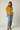 Female wearing a Yellow Solid Color   Western Style V-Neck Neckline Cotton Slub Tunic