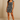 Female wearing a Black And White Leaf Asymmetrical  Print Babydoll Dress
