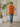 Female wearing a Orange Solid Color   Fusion Style Keyhole Neckline Cotton Slub Tunic