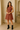 Female wearing a Rust Warli Print Babydoll Dress