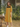 Female wearing a Yellow Solid Color A-Line V-Neck Neckline Mandarin Collar Dress