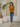 Female wearing a Mustard Solid Color   Fusion Style V-Neck Neckline Cotton Slub Tunic