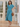 Female wearing a Ferozi Blue Solid Color Flared V-Neck Neckline No Collar Dress