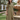 Female wearing a Beige Solid Color Empire Line Round Neckline Dress