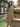 Female wearing a Beige Solid Color Empire Line Round Neckline Dress