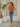 Female wearing a Orange Solid Color   Fusion Style Asymmetric Neckline Cotton Slub Tunic