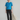 Female wearing a Ferozi Blue Solid Color Fusion Round Neckline No Collar Top
