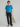 Female wearing a Ferozi Blue Solid Color Fusion Round Neckline No Collar Top