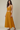 Female wearing a Yellow Solid Color   Fusion Style Cowl Neckline Cotton Slub Top