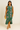 Female wearing a Emerald Green Sanganeri Pink Floral Butta Print Bodycan Dress