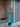 Female wearing a Ferozi Blue Solid Color   Kurta Style V Shaped Crew Neckline Cotton Slub Shirt