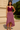 Female wearing a Maroon Solid Color Western V-Neck Neckline Top