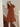 Female wearing a Rust Solid Color Pinafore Boat Neckline Dress